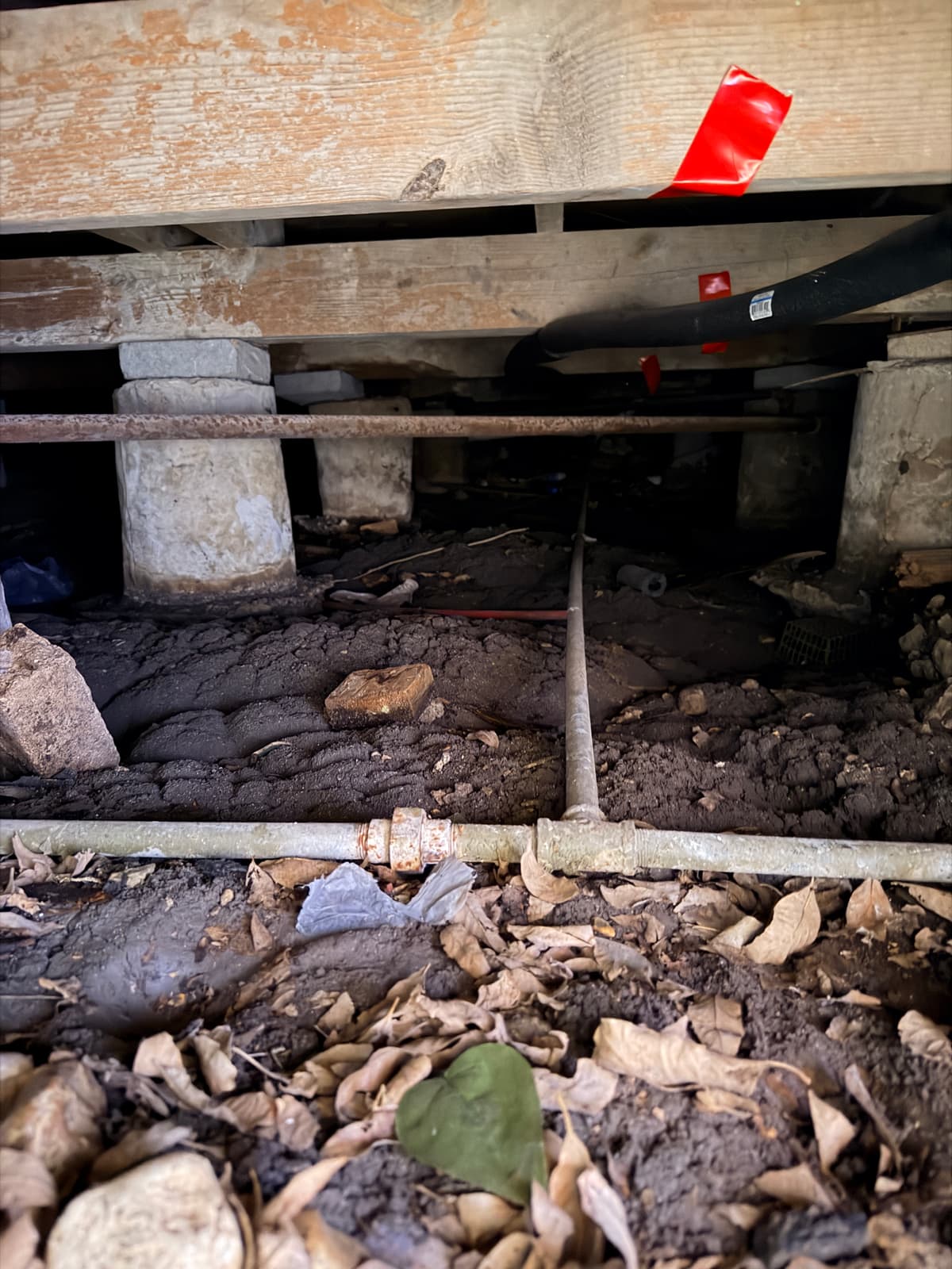 Makeshift concrete-block piers settling into dirt