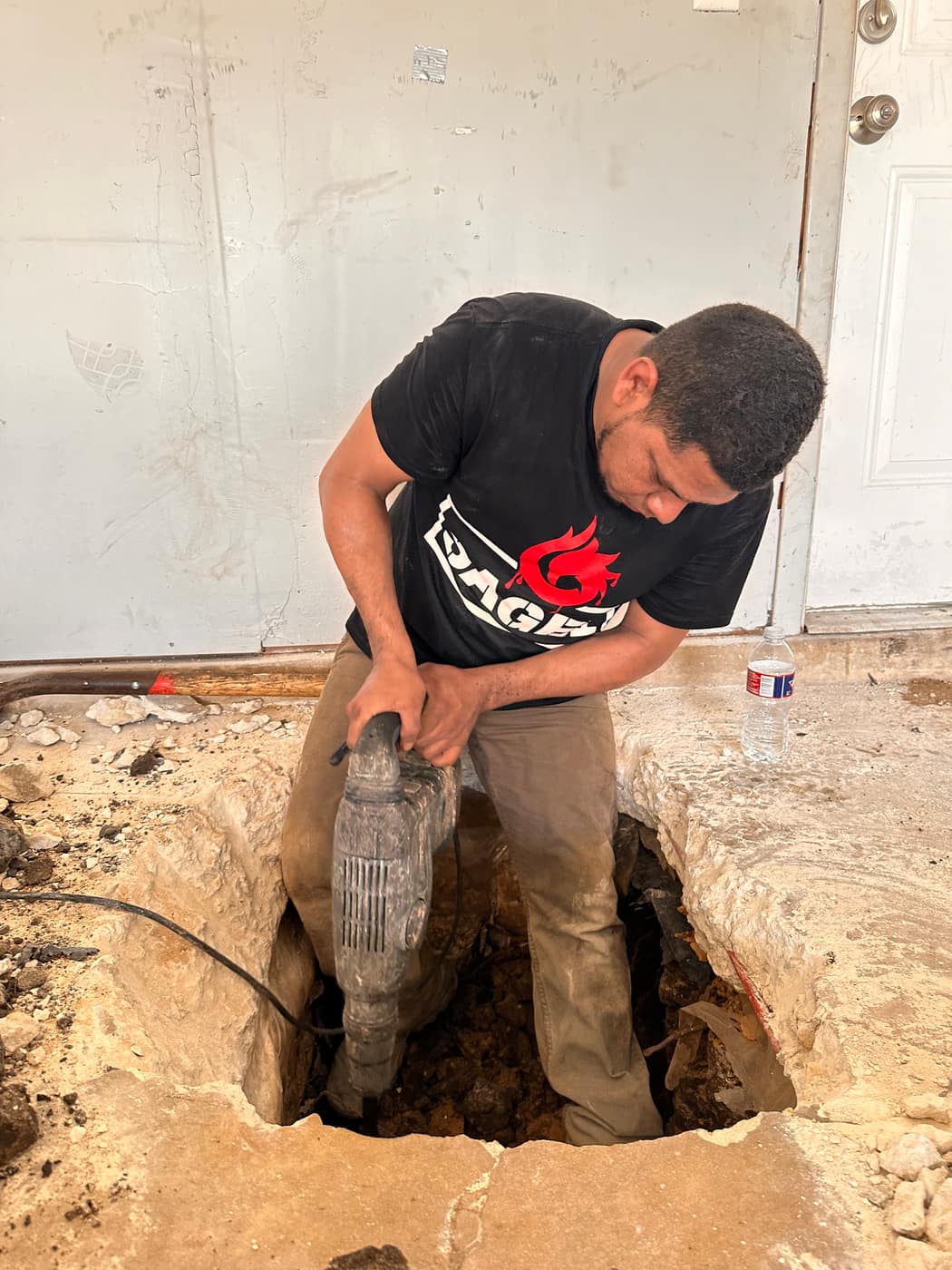 Sage FX technician inspecting a foundation excavation