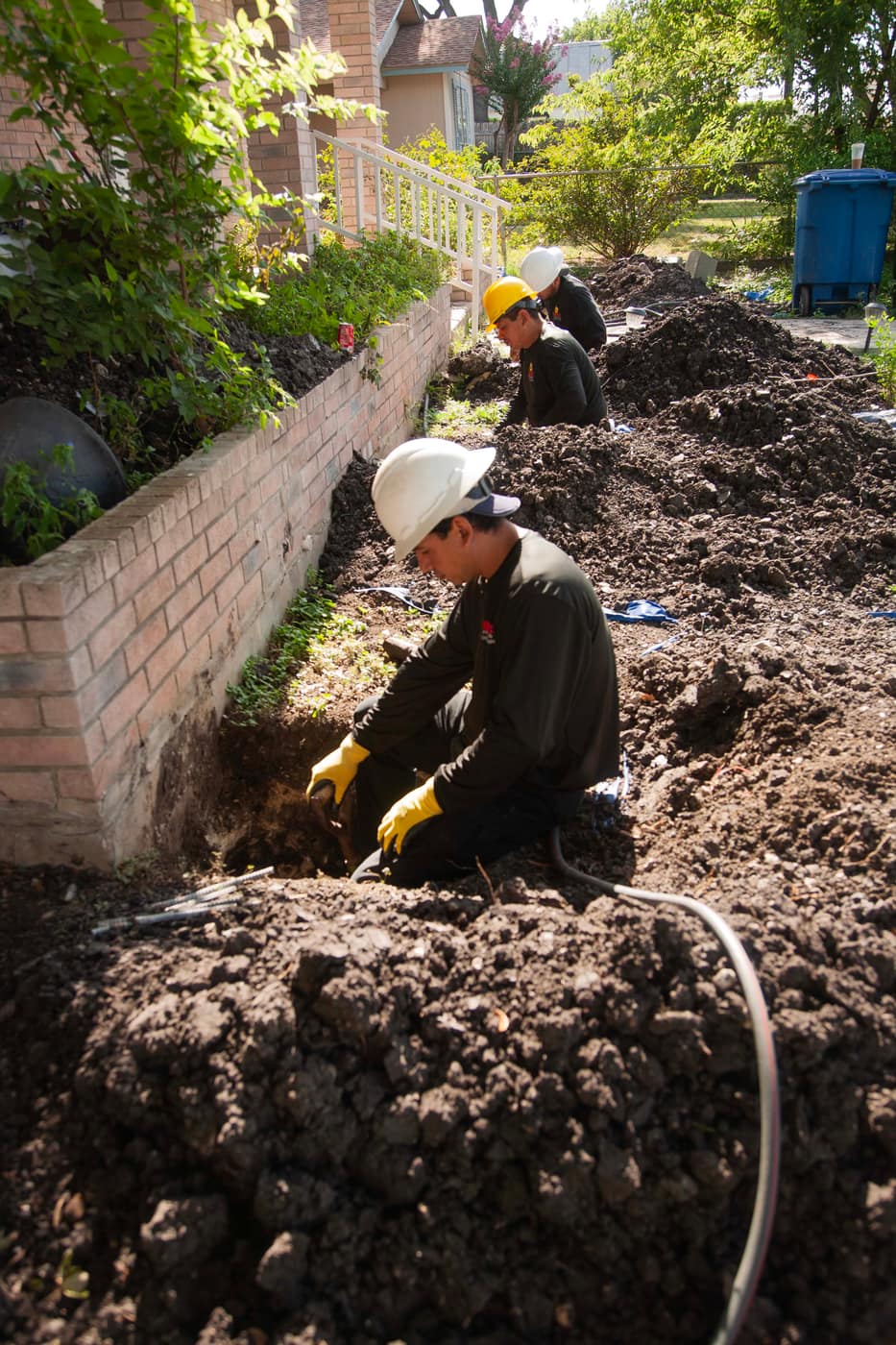 Inspecting foundation soil conditions in an excavated pit