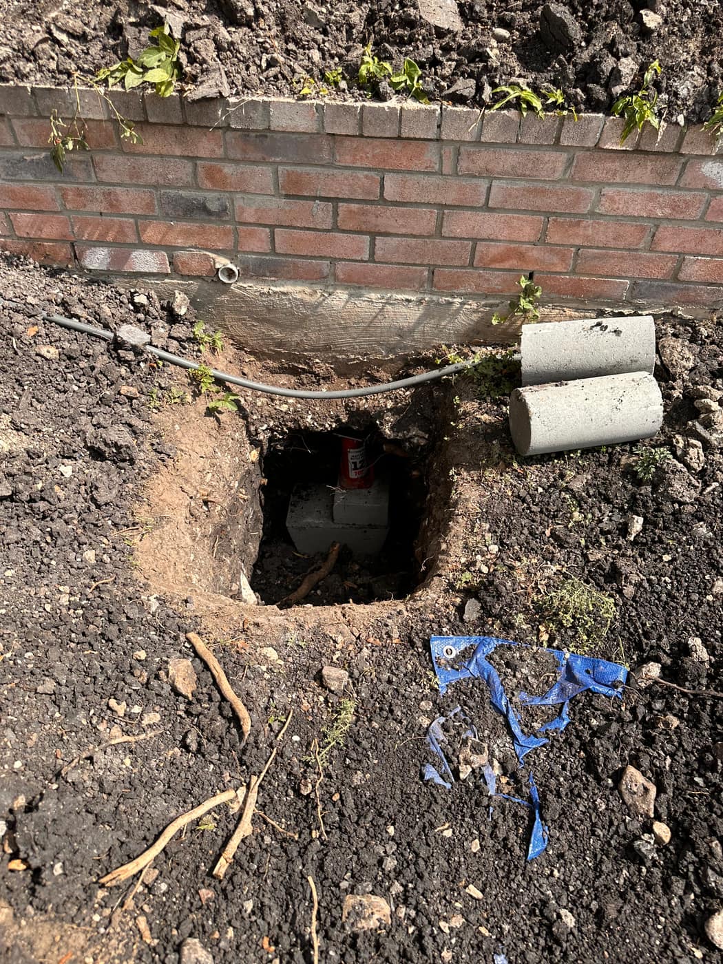 Corner pier excavation for house leveling