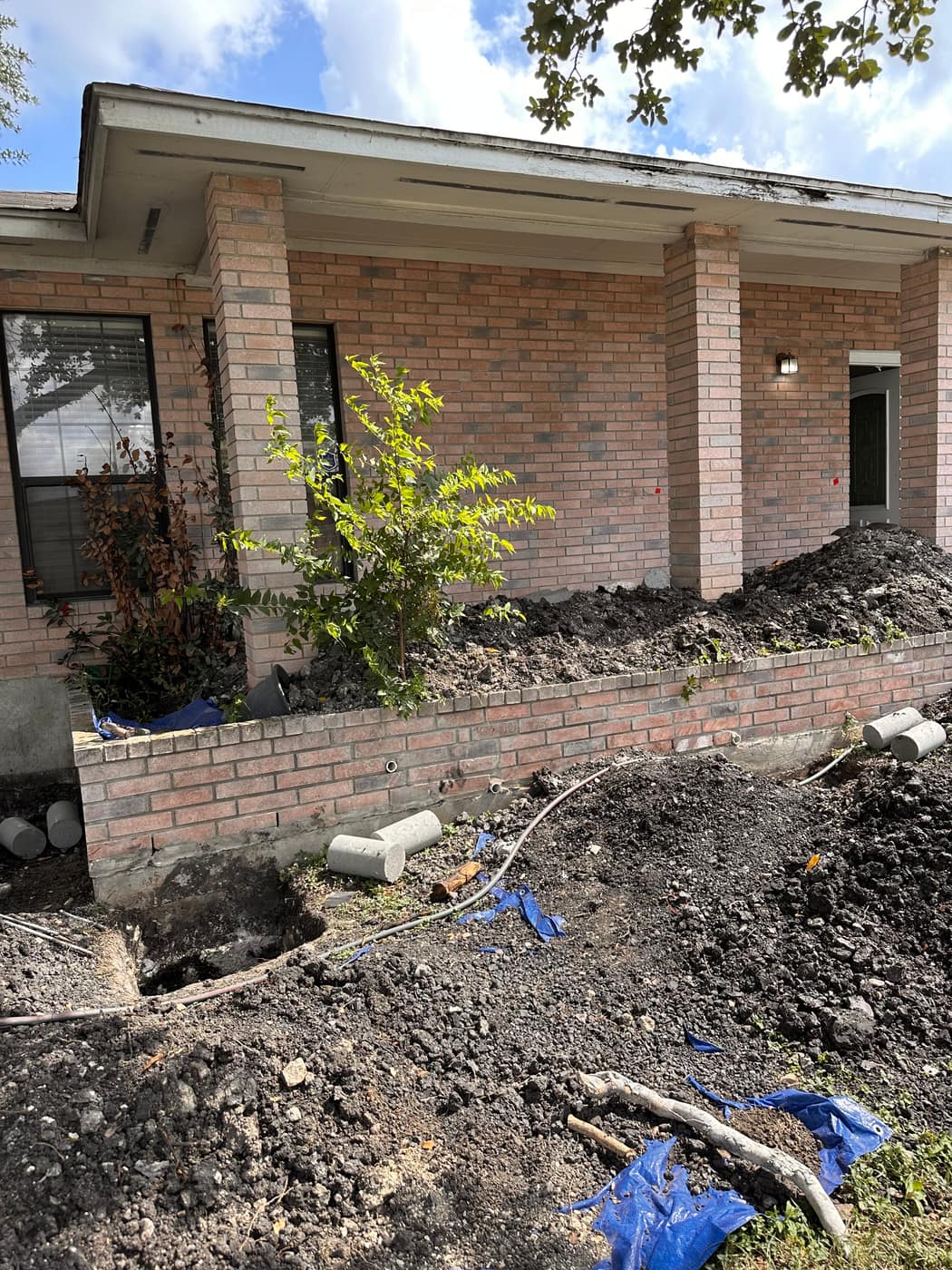Foundation repair excavation on a San Antonio brick home