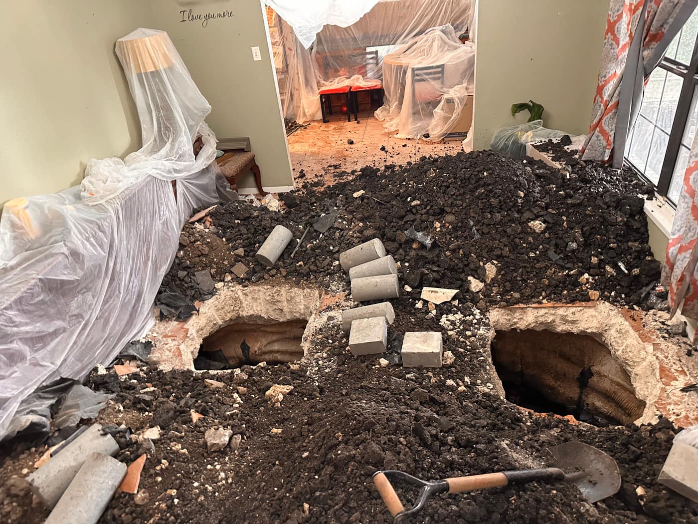 Interior slab foundation piering with protective floor covering