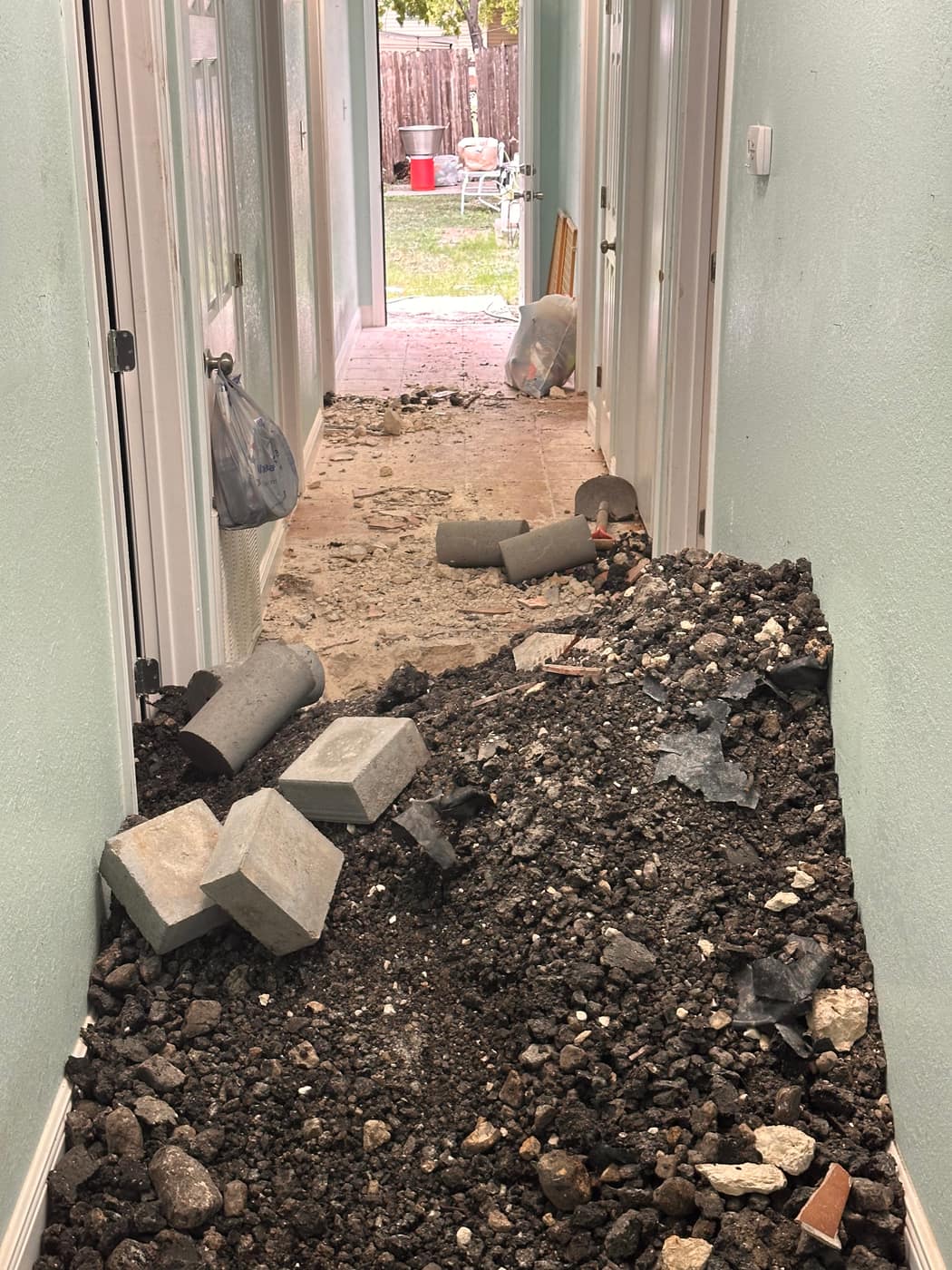Foundation repair beneath a home's exterior wall