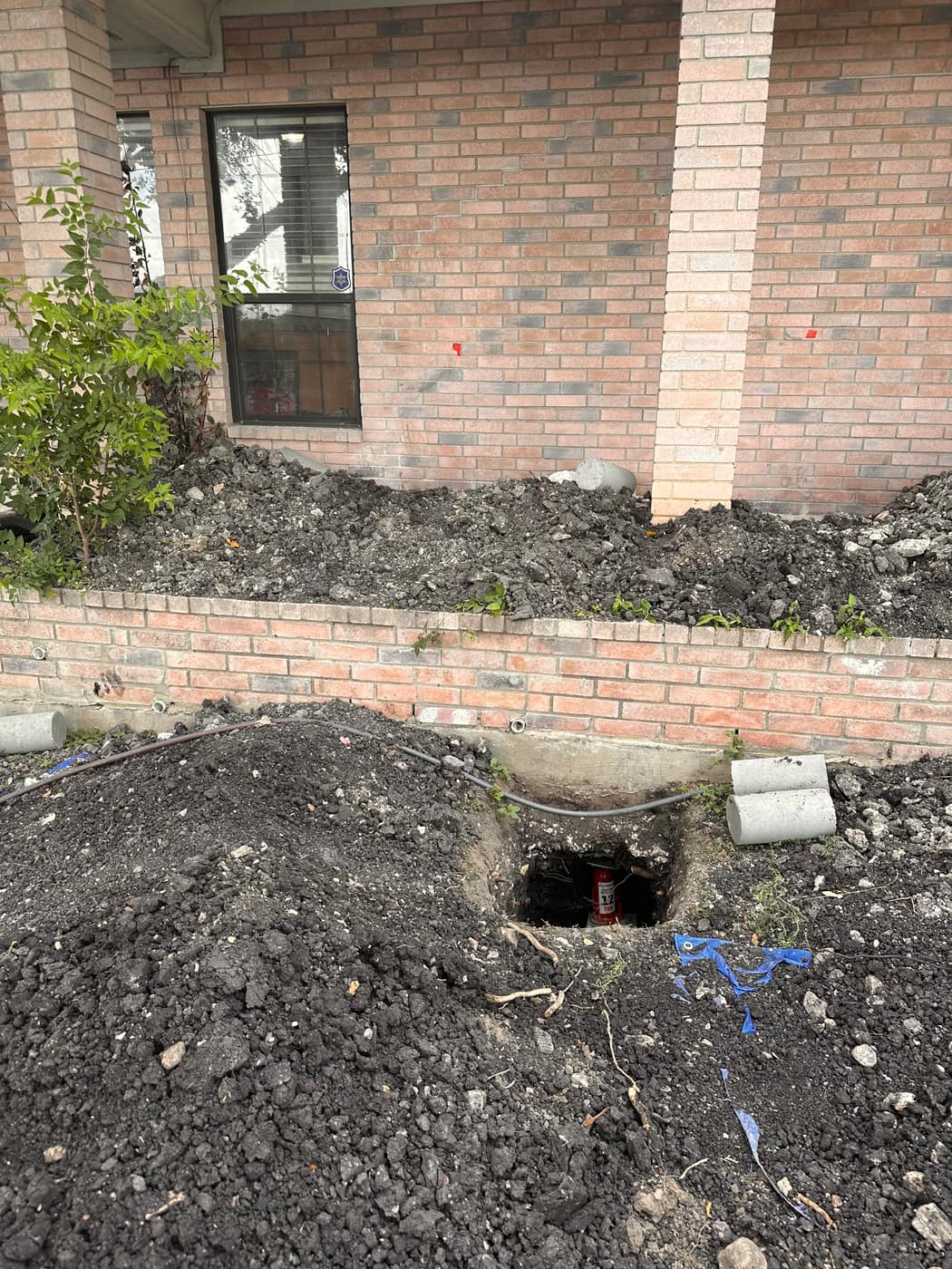 Drainage pipe installed along a repaired foundation