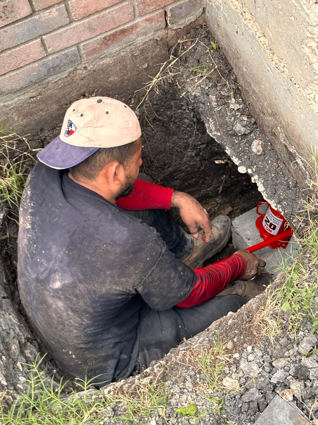 Sage FX technician working in a crawl space excavation