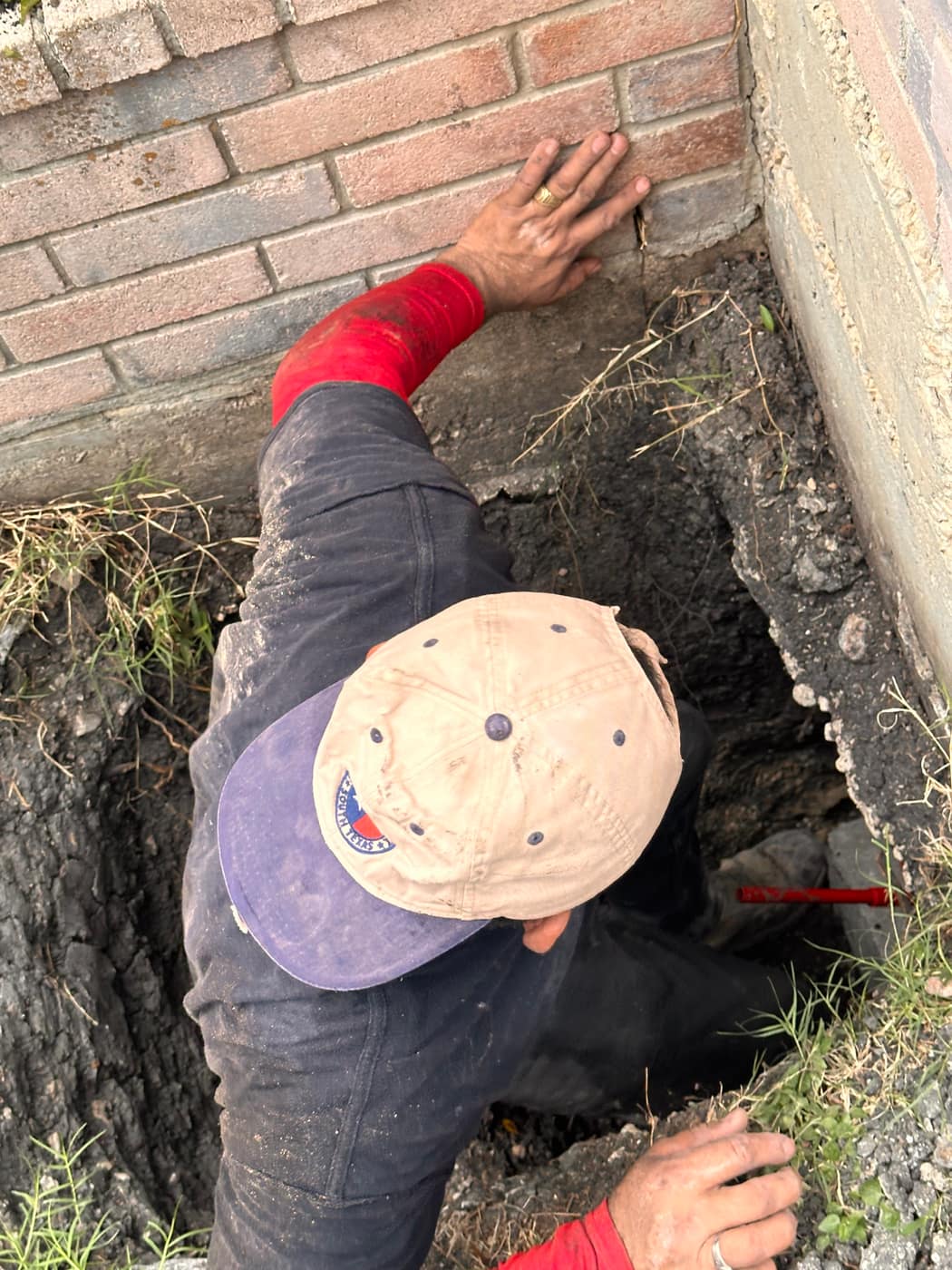 Sage FX technician finishing a foundation repair job