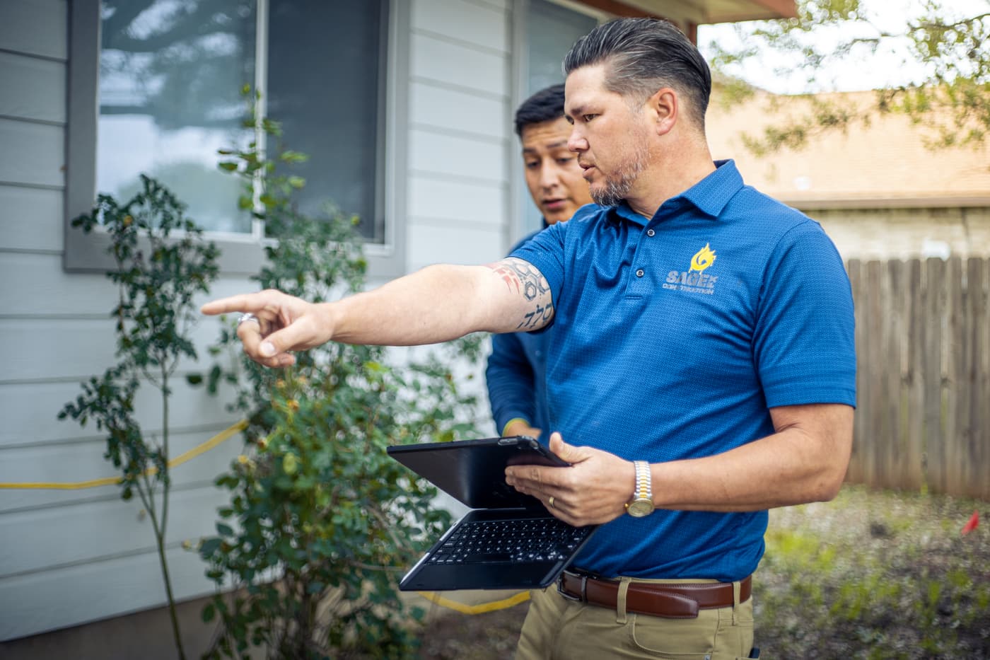 Sage FX owner inspecting a San Antonio home foundation