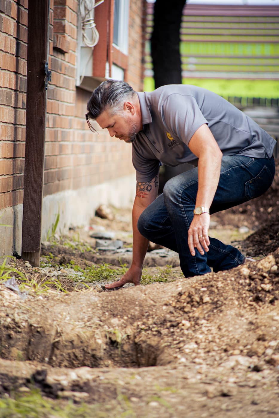Sage FX technician excavating a foundation