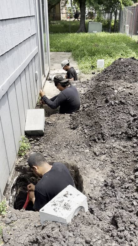 Setting a concrete pier beneath a foundation