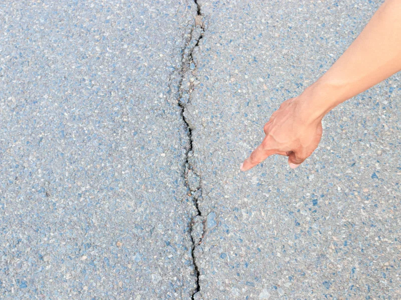 An image showing a foundation inspection with visible cracks and uneven floors.