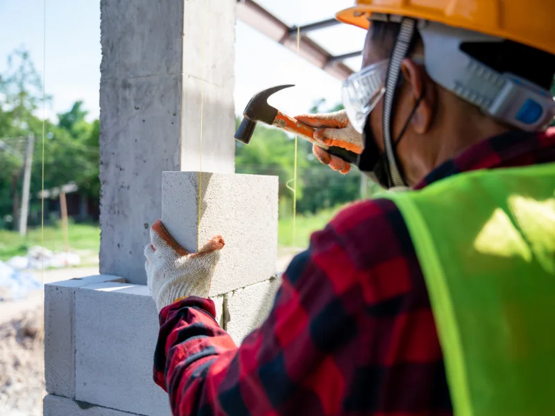 An image showing foundation contractors performing maintenance services, designed to fix foundation problems for homes in the San Antonio region.