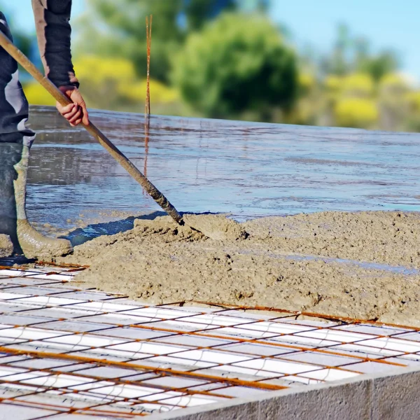 An image showing a team of foundation repair experts inspecting a home's foundation.