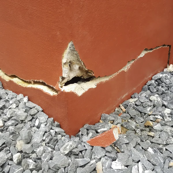 An image showing a house with visible foundation cracks.