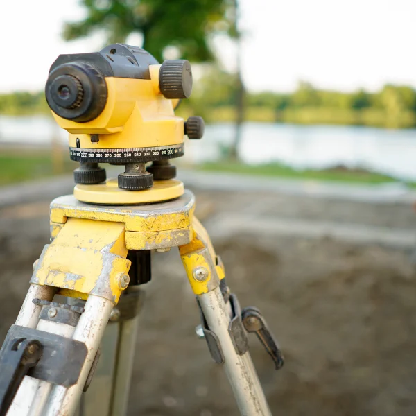 An image showing final measurements and adjustments being made after site clean-up.