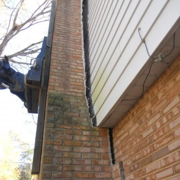 An image showing a chimney or porch separating from the main structure.